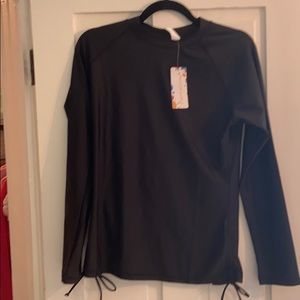 Black rash guard with tag